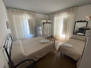 Postel nebo postele na pokoji v ubytování La Casa di Michele