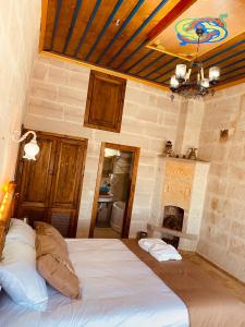 A bed or beds in a room at Zuwinasa House Hotel