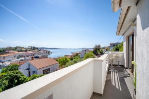 a balcony with a view of the water at Apartment Elizabeta in Sali