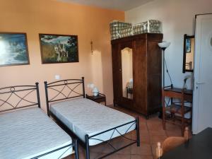 Ein Bett oder Betten in einem Zimmer der Unterkunft Mylos Garden