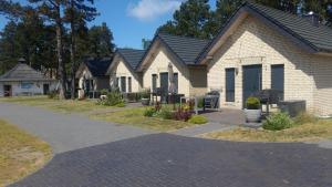 a row of houses on a street at Baltic Holiday Houses in Mielno