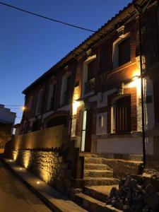 a building with stairs in front of it at night at Casa Perazancas At 34-49 in Perazancas