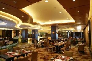 Um restaurante ou outro lugar para comer em New Century Grand Hotel Xuzhou