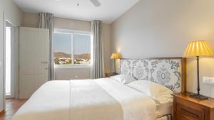 Кровать или кровати в номере Real Agua Amarga Las Villas