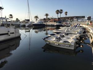 a group of boats are docked in a marina at Marbella Deluxe Rooms in Royal Cabopino Townhouse in Marbella
