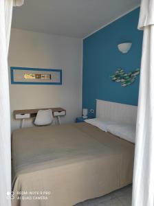 Ένα ή περισσότερα κρεβάτια σε δωμάτιο στο la lampara