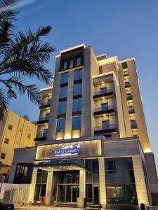 a building with a sign on the front of it at Beata Garden in Al Khobar