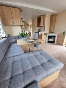 a living room with a couch and a table at elbry in Heysham