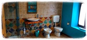 a bathroom with a sink and two toilets at Bed and Breakfast Balli coi Lupi in Varzi