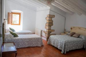 Ένα ή περισσότερα κρεβάτια σε δωμάτιο στο Romegosa Benestar