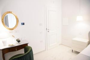 a white bathroom with a vanity and a mirror at Tenuta Tropeano in Tropea +51 photos
