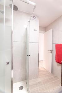 a shower with a glass door in a bathroom at virginia-48 in Benidorm +9 photos