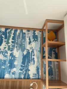 a bedroom with a blue and white wall at B&B Giro Di Boa in Lampedusa