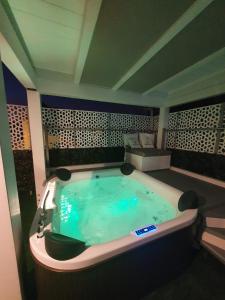a jacuzzi tub in a room with at Foresterie Lombarde B&B Villa Ambra in Limbiate