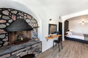 Voodi või voodid majutusasutuse Pearl of Caldera Oia - Boutique Hotel by Pearl Hotel Collection toas +37 fotot