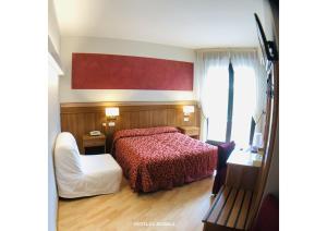 Postel nebo postele na pokoji v ubytování Hotel La Bussola