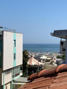 a view of the beach from a building at Hotel Tre Grazie in Rimini
