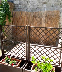 a garden with a fountain and some plants at La Sciuscella in Conca dei Marini