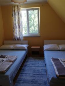 Postel nebo postele na pokoji v ubytování MaYorka Dom Letni Giżycko