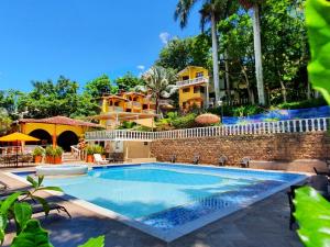 בריכת השחייה שנמצאת ב-Hotel Posada Campestre San Gil או באזור