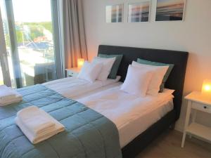 Posteľ alebo postele v izbe v ubytovaní Balticus Apartament Premium