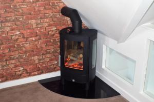 a fireplace in a room with a brick wall at THE HIDEAWAY - LUXURY SELF CATERING COASTAL APARTMENT with PRIVATE ENTRANCE & KEY BOX ENTRY JUST A FEW MINUTES WALK TO THE BEACH, SOLENT WAY WALK, SHOPS and many EATERIES & BARS - FREE OFF ROAD PARKING,FULL KITCHEN, LOUNGE,BEDROOM , BATHROOM & WI-FI in Lymington