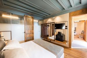 Postel nebo postele na pokoji v ubytování Domus Renier Boutique Hotel
