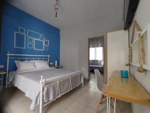 Poseidon Rooms客房内的一张或多张床位