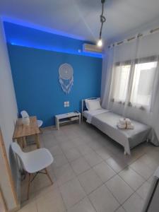 Poseidon Rooms客房内的一张或多张床位