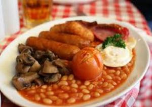 a plate of food with beans and vegetables on a table at Seacroft Guest House in Paignton