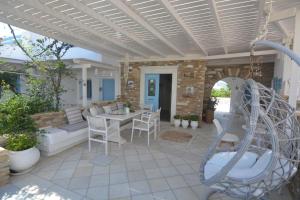 a patio with a playground with a slide at ThalaSEA - village Antiparos in Antiparos