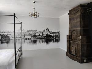 a bedroom with a bed and a view of a river at Willa Viktor in Kristinestad