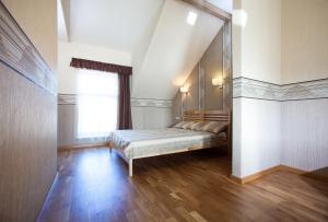 Un pat sau paturi într-o cameră la Liepas