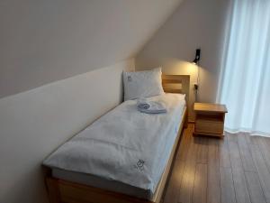 Posteľ alebo postele v izbe v ubytovaní Sowi Kąt - Domki z Baliami oraz Tradycyjne