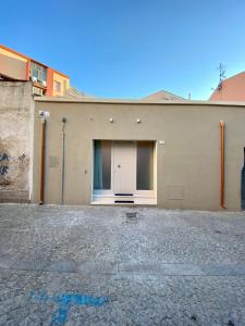 a building with a door on the side of it at Enjoy Olbia in Olbia