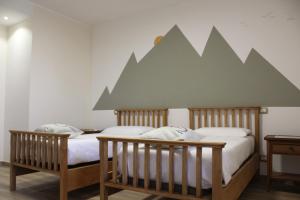 Ένα ή περισσότερα κρεβάτια σε δωμάτιο στο B&B Villa Verona Bike