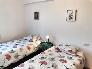 Säng eller sängar i ett rum på Casa Courcelles - Viveiro