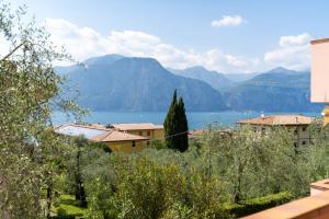 a view of a lake with mountains in the background at LAKE Beth's House in Brenzone sul Garda