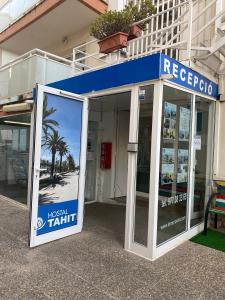 a blue and white building with a sign on it at Hostal Tahiti RS in Salou