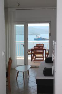 a living room with a view of the ocean at Bella Vista in Komarna