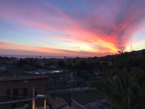 The sunrise or sunset as seen from a panziókat or nearby