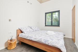 Postel nebo postele na pokoji v ubytování Unique Design Vila Doris