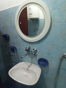 a bathroom with a sink and a mirror at Uroš in Kamenari