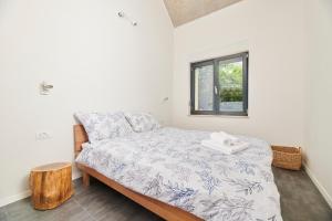 Postel nebo postele na pokoji v ubytování Unique Design Vila Doris