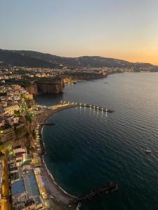 an aerial view of a beach with a bridge in the water at Sorrento City Center Atmosphere in Sorrento