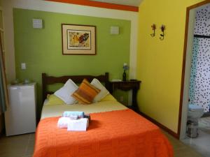 En eller flere senge i et værelse på Bicho do Mato Suites