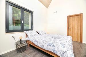 Postel nebo postele na pokoji v ubytování Unique Design Vila Doris