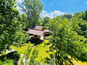 an aerial view of a cabin in the middle of trees at Dunakanyar Apartman in Pilismarót