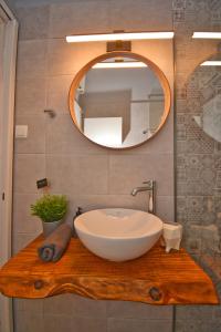 a bathroom with a sink and a mirror at Yia Sou Corfu! "Kolibri" in Sinarádes +83 photos