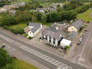 an aerial view of a small town with a street at Moran's Bar & B&B in Grange